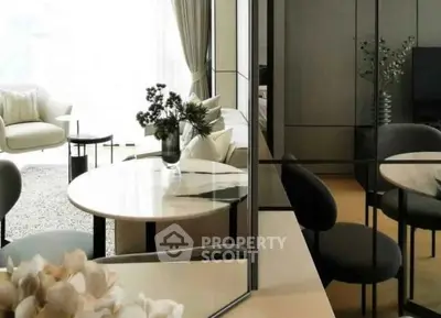 Elegant modern living room with stylish furniture and large windows for natural light.