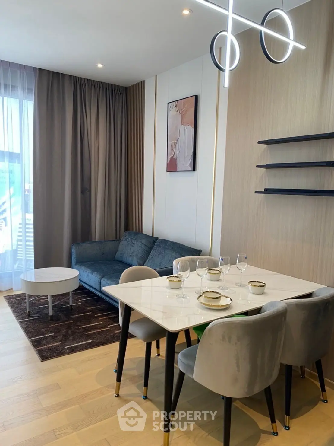 Modern living room with elegant dining area and stylish decor