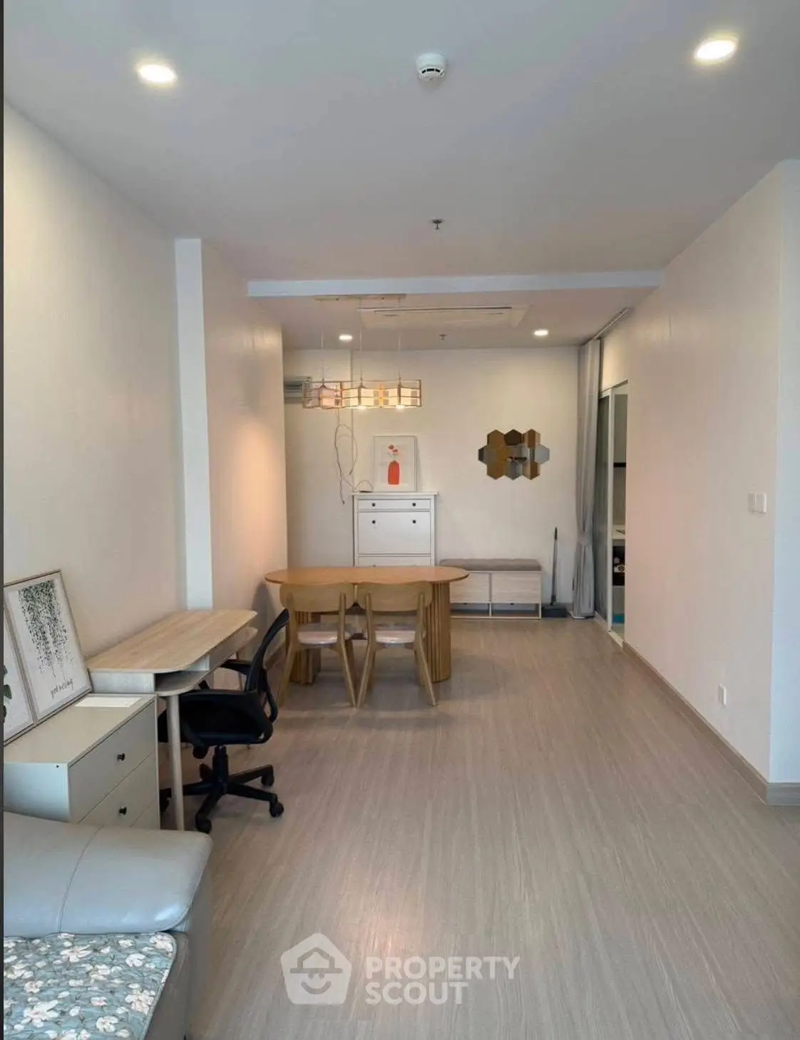 Modern living room with stylish furniture and elegant lighting in a cozy apartment.