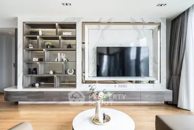 Luxurious modern living room with sleek TV unit and elegant decor