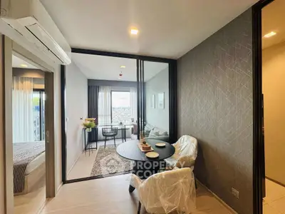 Modern apartment with open living and dining area featuring city view.