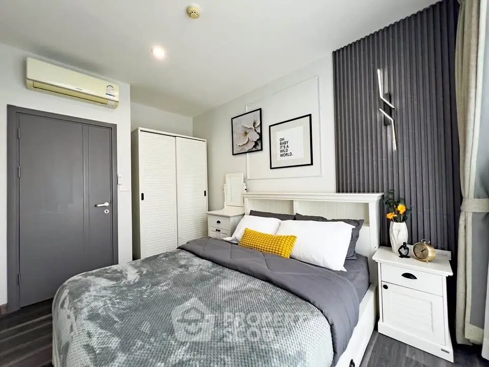 Modern bedroom with stylish decor, featuring a cozy bed, elegant lighting, and ample storage space.