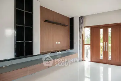 Spacious modern living room with sleek wooden accents and large windows