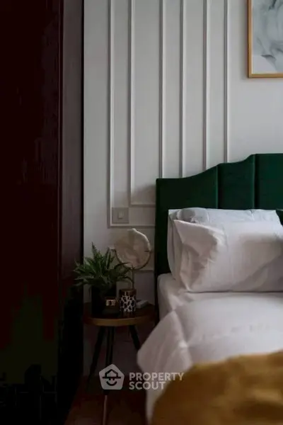 Cozy bedroom with elegant decor and plush bedding, perfect for relaxation.