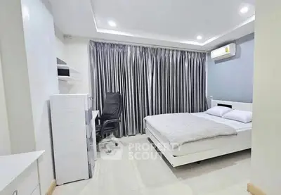 Modern bedroom with sleek design and ample natural light