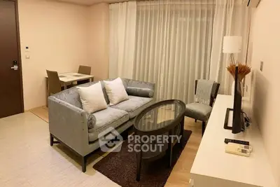 Modern living room with stylish furniture and elegant decor in a cozy apartment setting.