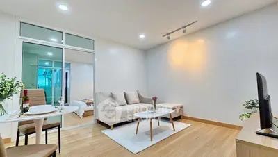 Modern living room with cozy sofa and dining area in open layout apartment