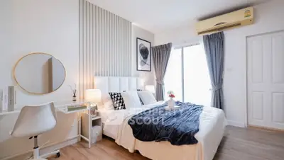 Modern bedroom with stylish decor and natural light