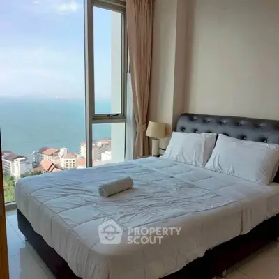 Luxurious bedroom with stunning ocean view and elegant decor