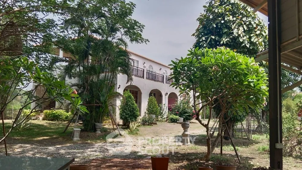 Charming villa surrounded by lush greenery and spacious garden