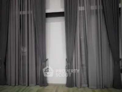 Elegant floor-to-ceiling curtains in modern living space