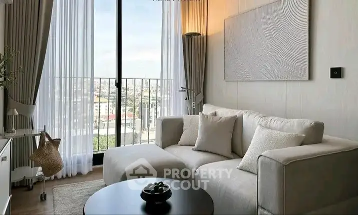 Modern living room with cozy sofa and city view from large window