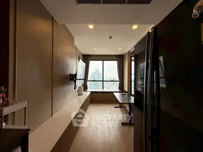 Modern living room with city view, featuring sleek design and ample natural light.