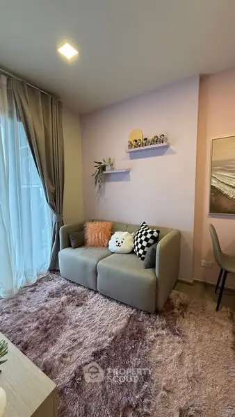 Cozy living room with plush rug and modern decor, perfect for relaxation.