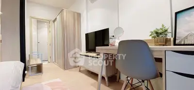 Modern bedroom with stylish furniture and TV, perfect for comfortable living.