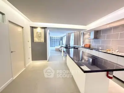 Modern open-layout kitchen with sleek countertops and spacious living area