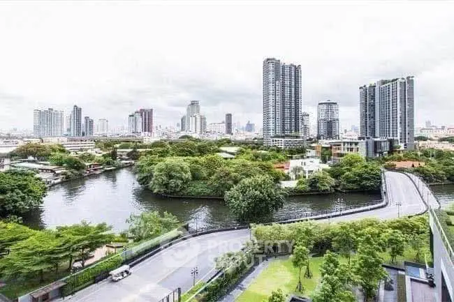 Stunning cityscape view with lush greenery and modern high-rise buildings.