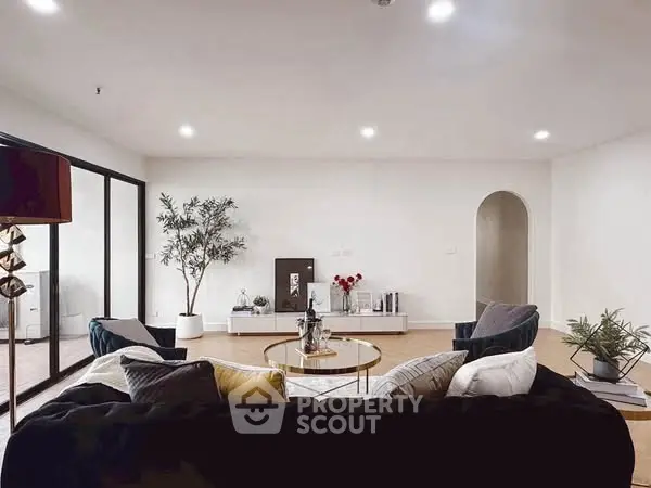 Spacious modern living room with elegant decor and natural light
