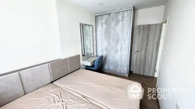 Modern minimalist bedroom with sleek wardrobe and stylish vanity desk