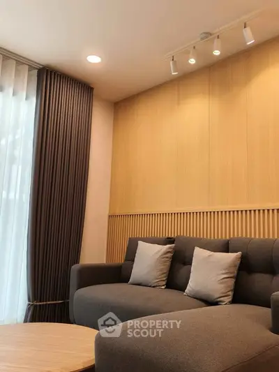 Modern living room with stylish sofa and elegant lighting