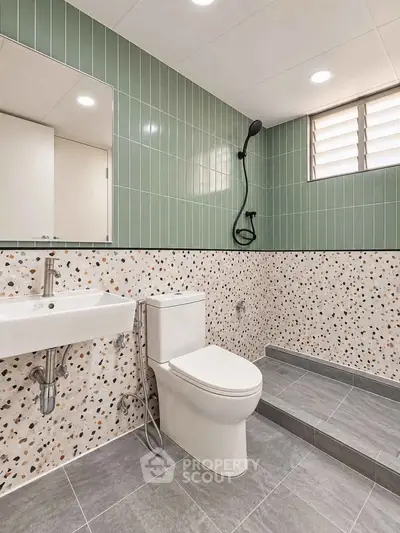 Modern bathroom with terrazzo tiles and sleek fixtures