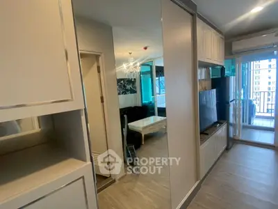 Modern apartment interior with open living room and balcony view