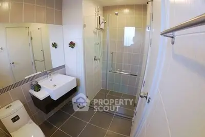 Modern bathroom with glass shower and sleek fixtures