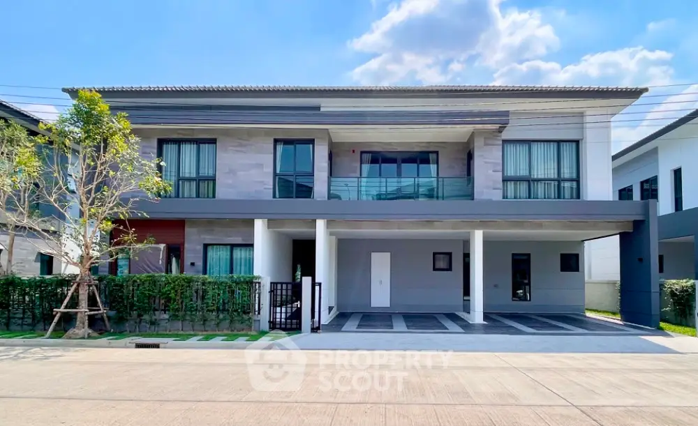 Modern two-story house with spacious driveway and contemporary design