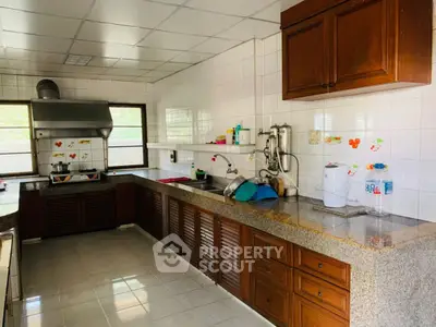 Spacious kitchen with closed layout and ample counter space in a modern home.