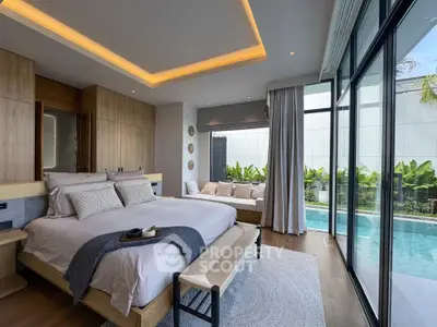 Luxurious bedroom with pool view and modern decor, featuring floor-to-ceiling windows and elegant lighting.