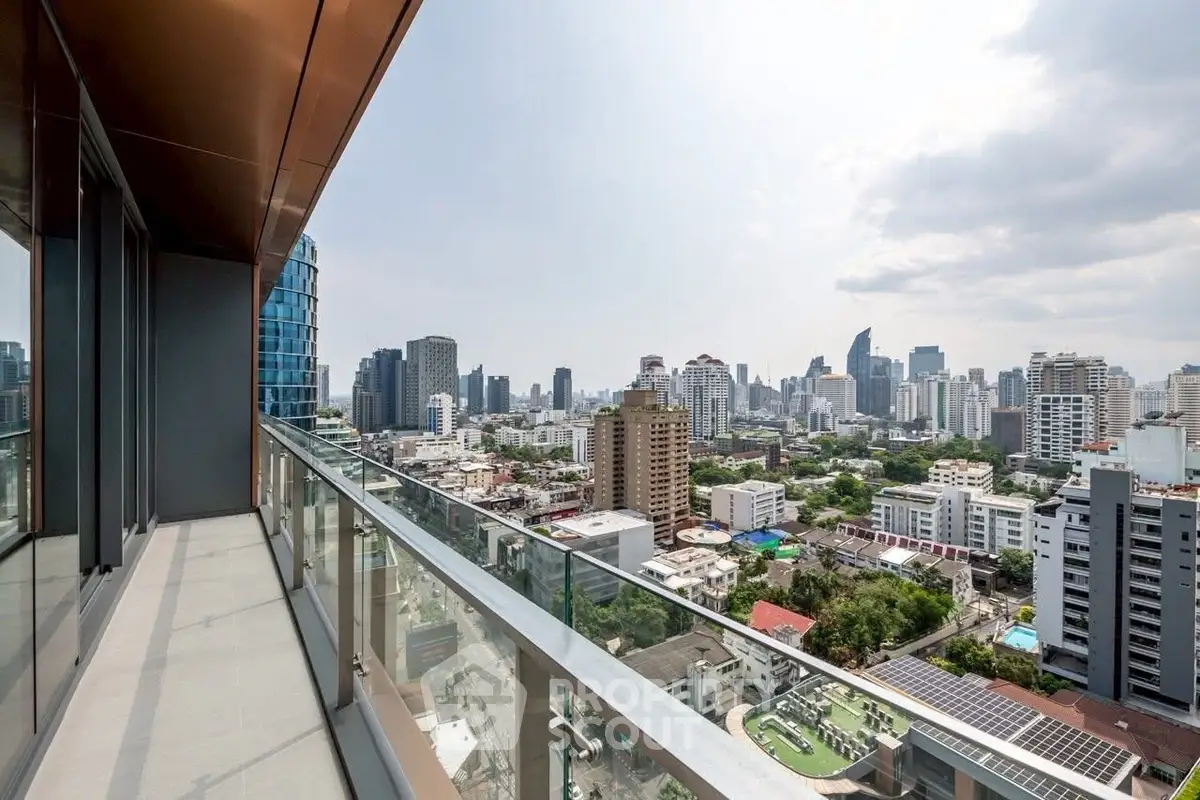 Stunning cityscape view from a modern high-rise balcony, perfect for urban living.