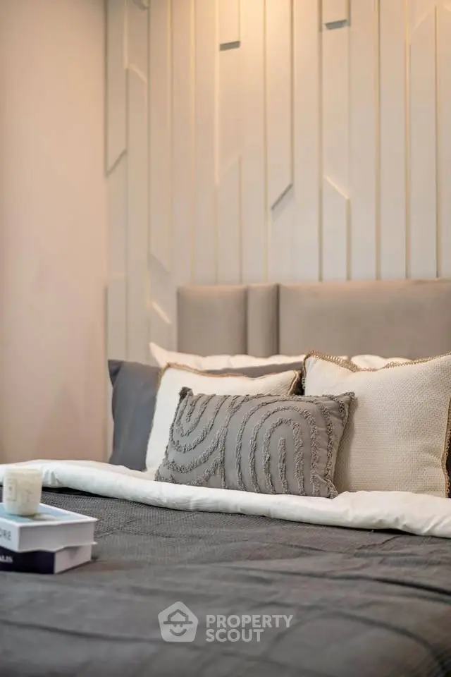 Luxurious bedroom with elegant decor and plush pillows, perfect for relaxation.