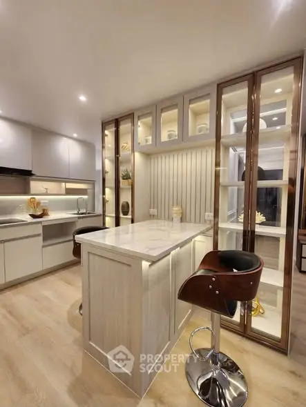 Modern kitchen with sleek cabinetry and stylish island seating