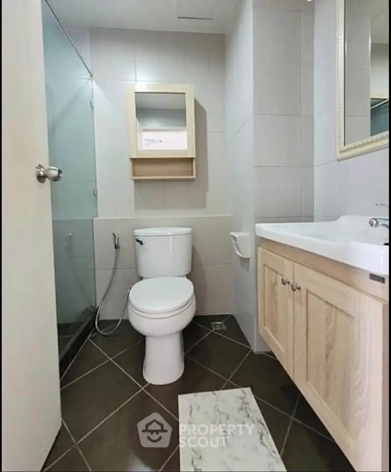 Modern bathroom with sleek fixtures and elegant cabinetry in a contemporary home.