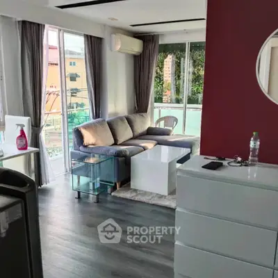 Modern living room with large windows and stylish furniture