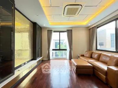 Spacious living room with modern design and large windows for natural light