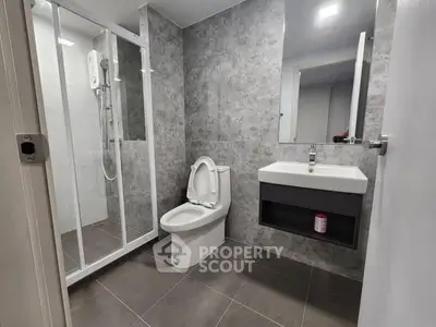 Modern bathroom with shower and sleek design