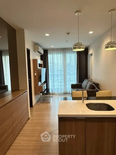 Modern living room with open kitchen and stylish decor