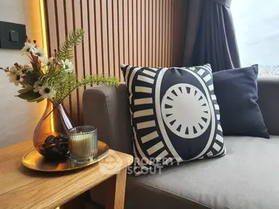 Stylish modern living room with elegant decor and cozy seating area.