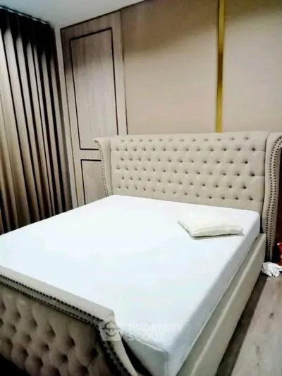 Luxurious bedroom with elegant tufted bed and stylish decor