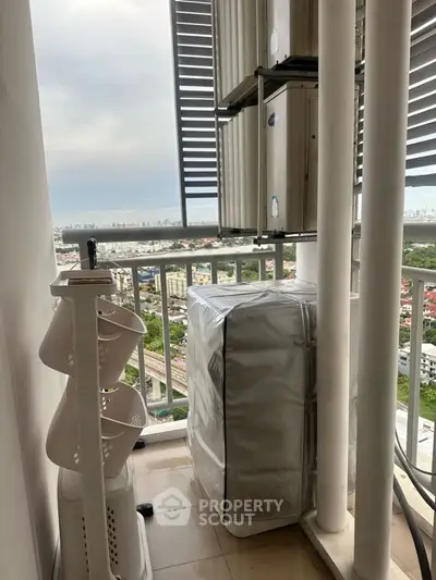 High-rise balcony with city view and air conditioning units