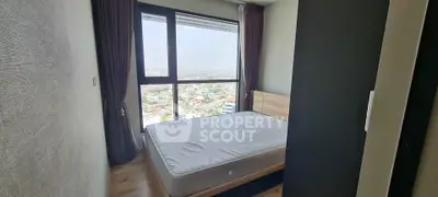Cozy bedroom with panoramic city view and large window