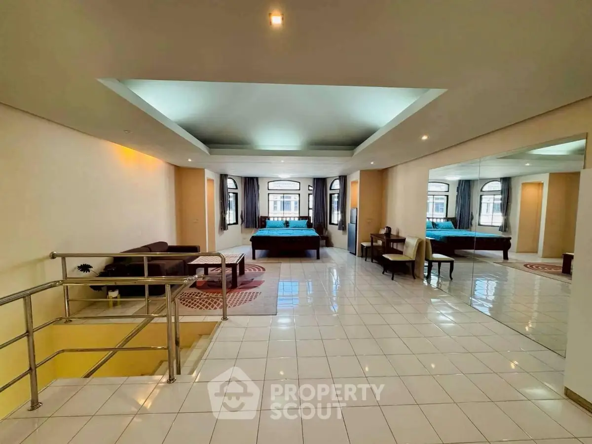 Spacious open-plan living area with modern decor and ample natural light.