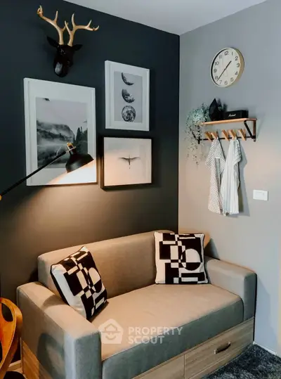 Stylish living room with modern decor, cozy sofa, and artistic wall art for a chic urban lifestyle.