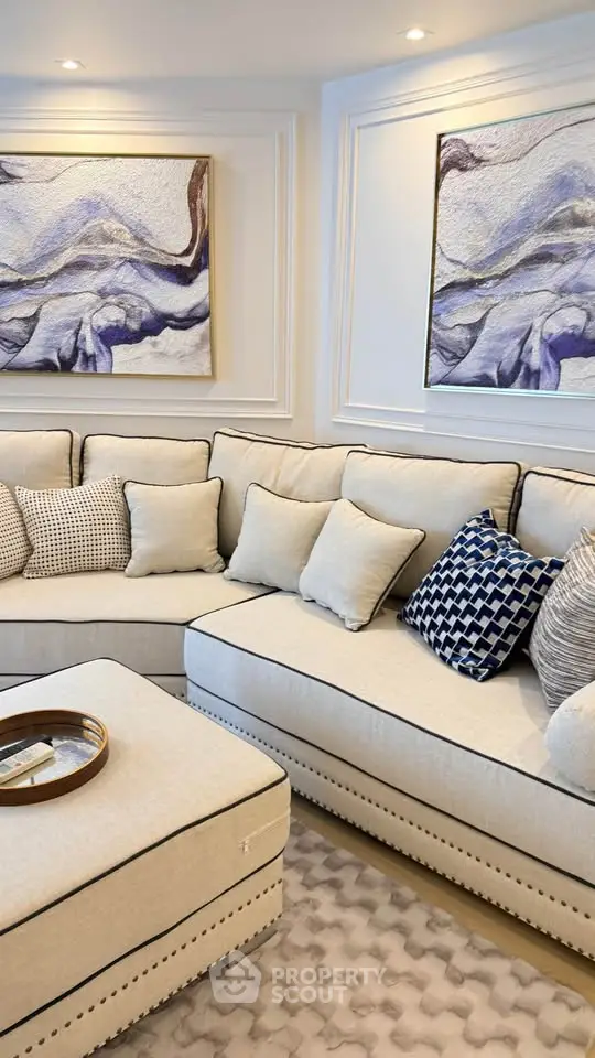 Luxurious living room with elegant sectional sofa and modern art decor