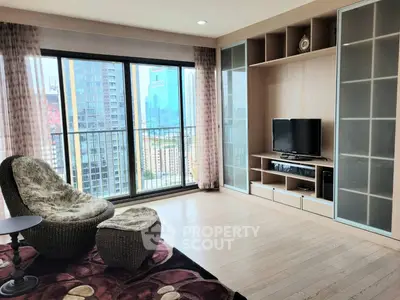 Spacious living room with city view and modern entertainment center