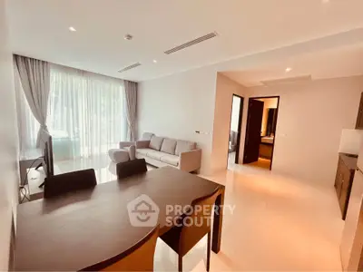 Spacious modern living room with elegant dining area and natural light