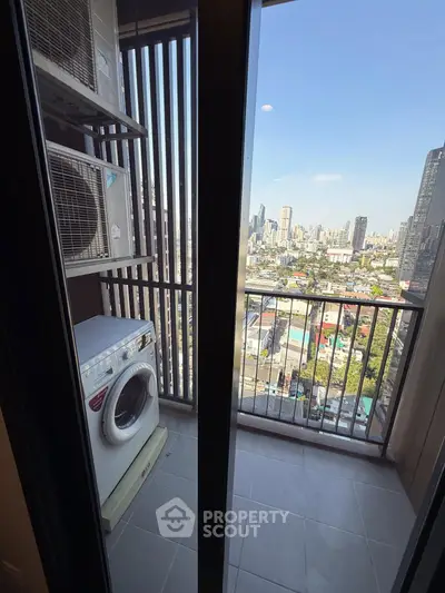 Urban balcony with washing machine and city skyline view