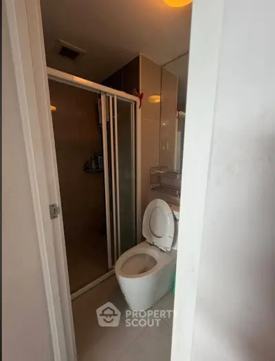 Modern bathroom with glass shower and sleek toilet design