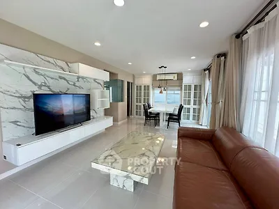 Luxurious living room with marble accents and modern furnishings